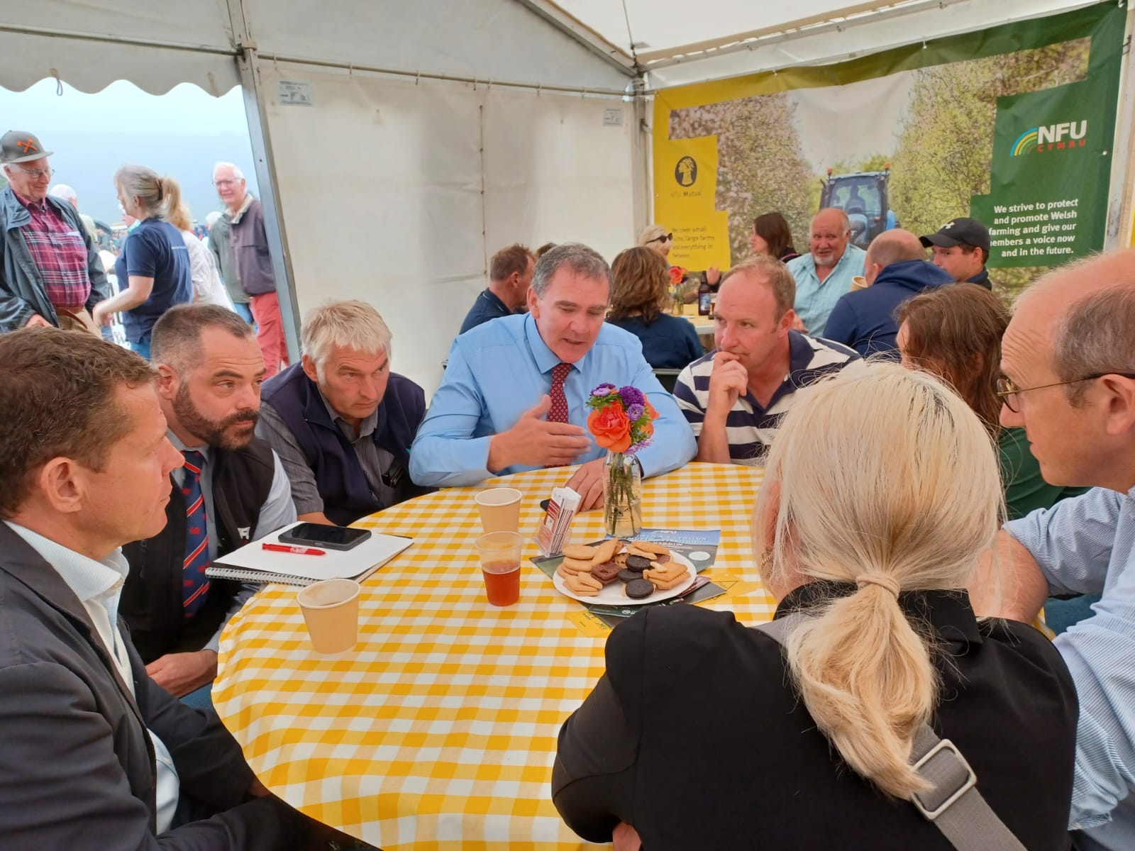 Members of NFU Cymru round a table with politicians at Meirionnydd County Show