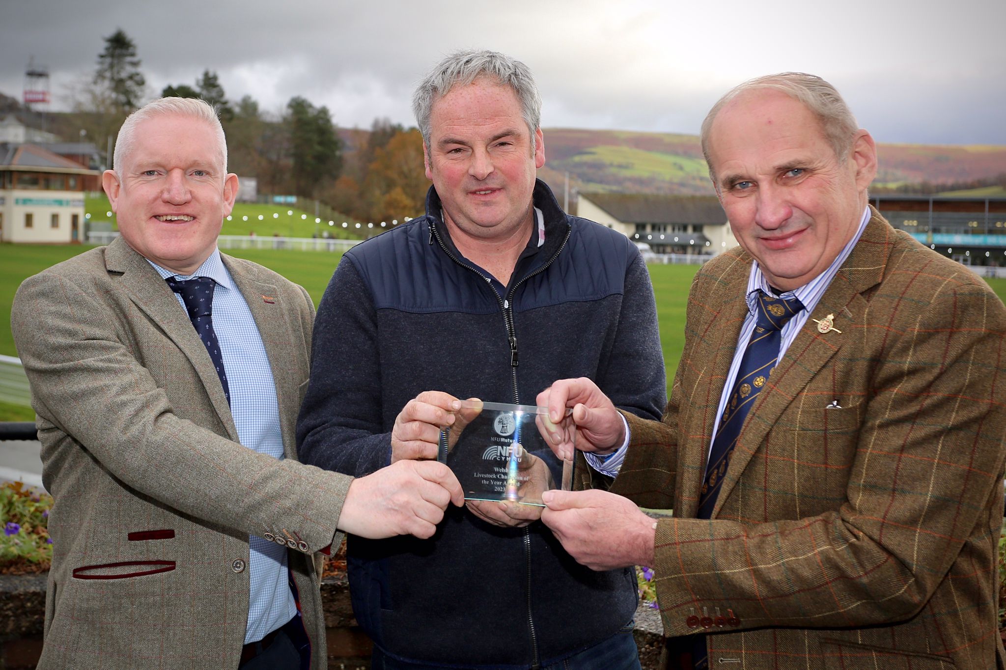 Award winner, Mark Davies with judges Mike Thomas, NFU Mutual and Rob Lewis, NFU Cymru Livestock Board Chairman